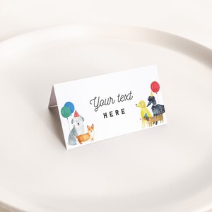 May include: White place card with a watercolor illustration of four dogs wearing party hats and holding balloons. The text "Your text HERE" is printed on the card.