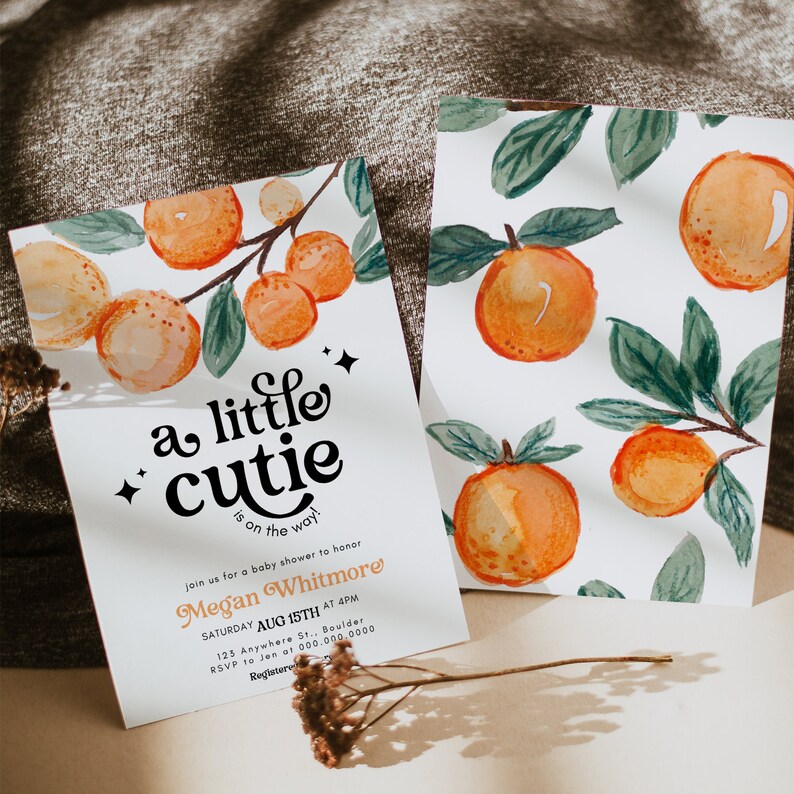 May include: A baby shower invitation with a watercolor illustration of oranges and leaves. The text reads "a little cutie is on the way!" and includes the name "Megan Whitmore" and details for the event.
