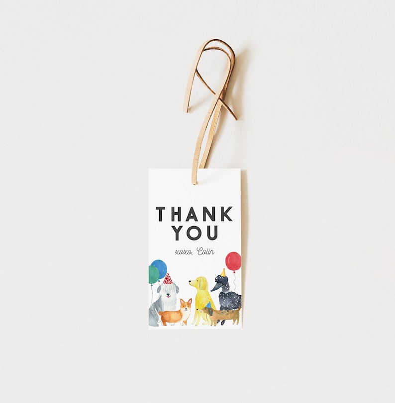 May include: Thank you card with a white background and black text that says "Thank You" with the name "Colin" written below. The card features a watercolor illustration of five dogs wearing party hats and holding balloons.