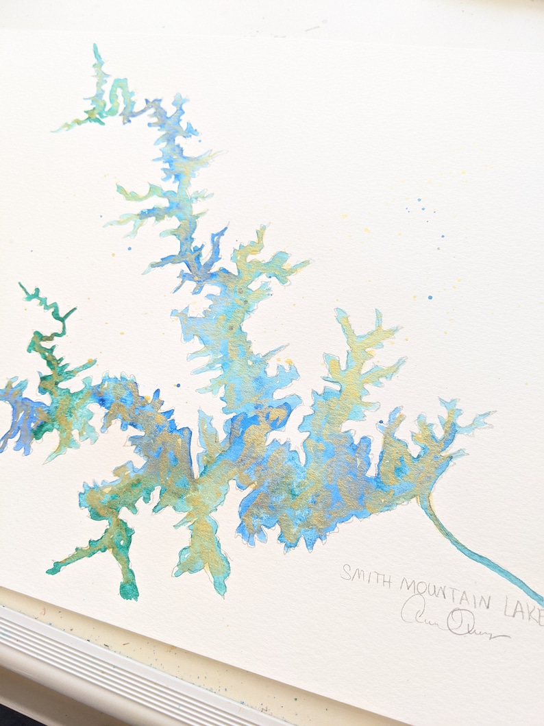 May include: Watercolor painting of Smith Mountain Lake in shades of blue, green, and gold. The painting is signed "Alan Olson" in the bottom right corner.