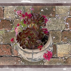 May include: A white ceramic planter with a variety of succulents and pink flowers growing inside. The planter is sitting on a brick patio.