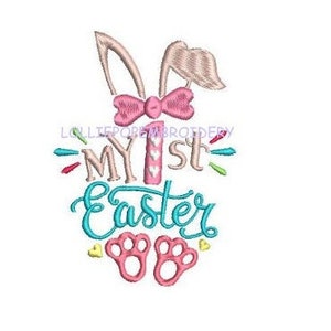 May include: Embroidered design featuring a pink bunny with a bow, the text "My 1st Easter" in blue and pink, and two pink bunny footprints.