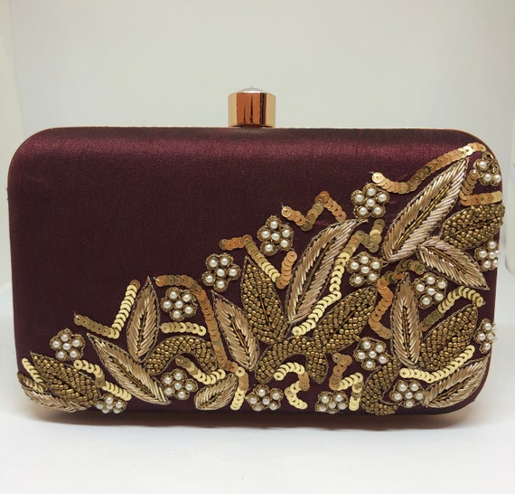 plum clutch