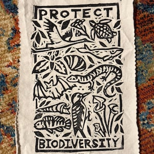 protect biodiversity patch linocut threatened species