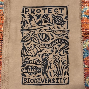 protect biodiversity patch linocut threatened species