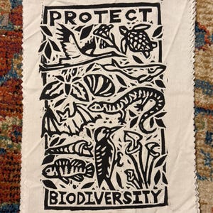 protect biodiversity patch linocut threatened species