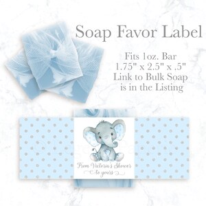 May include: Blue and white soap favor label with a cute elephant illustration. The label is 1.75 inches by 2.5 inches and fits a 1 ounce bar of soap. The text on the label reads "From Victoria's Shower to yours".