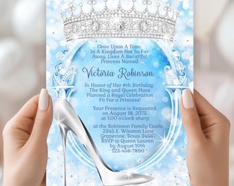 Puede incluir: Una invitación de princesa azul y plateada con un zapato de cristal plateado. La invitación dice "Érase una vez, en un reino no tan lejos, vivía una hermosa princesa llamada Victoria Robinson En honor a su # cumpleaños. El rey y la reina han planeado una celebración real digna de una princesa! Se solicita su presencia el 18 de agosto de 2075 a la 1:00 p. m. en el castillo de la familia Robinson 2345 E. Winston Lane Grapevine, Texas 34567 Confirme su asistencia a la reina Lauren antes del 10 de agosto 123-456-7890*"