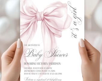 May include: A pink baby shower invitation with a large pink bow and the text "it's a girl" in cursive. The invitation includes the text "You are invited to Baby Shower honoring Victoria Anderson" and details for the event.