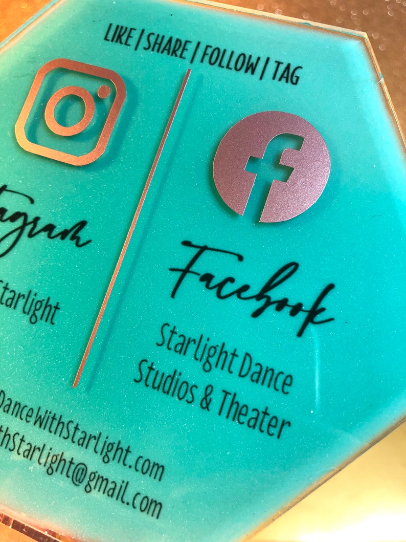 May include: A turquoise hexagonal sign with the text "LIKE | SHARE | FOLLOW | TAG" at the top. The left side of the sign features an Instagram logo and the text "gram starlight" and the right side features a Facebook logo and the text "Facebook Starlight Dance Studios & Theater Dance WithStarlight.com hStarlight@gmail.com".
