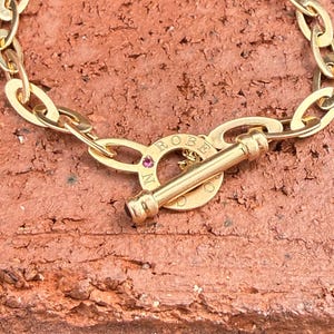 Authentieke Roberto Coin armband met robijn en saffier cabochon, sluiting en 18k roségouden schakels, 18 inch (18 cm).