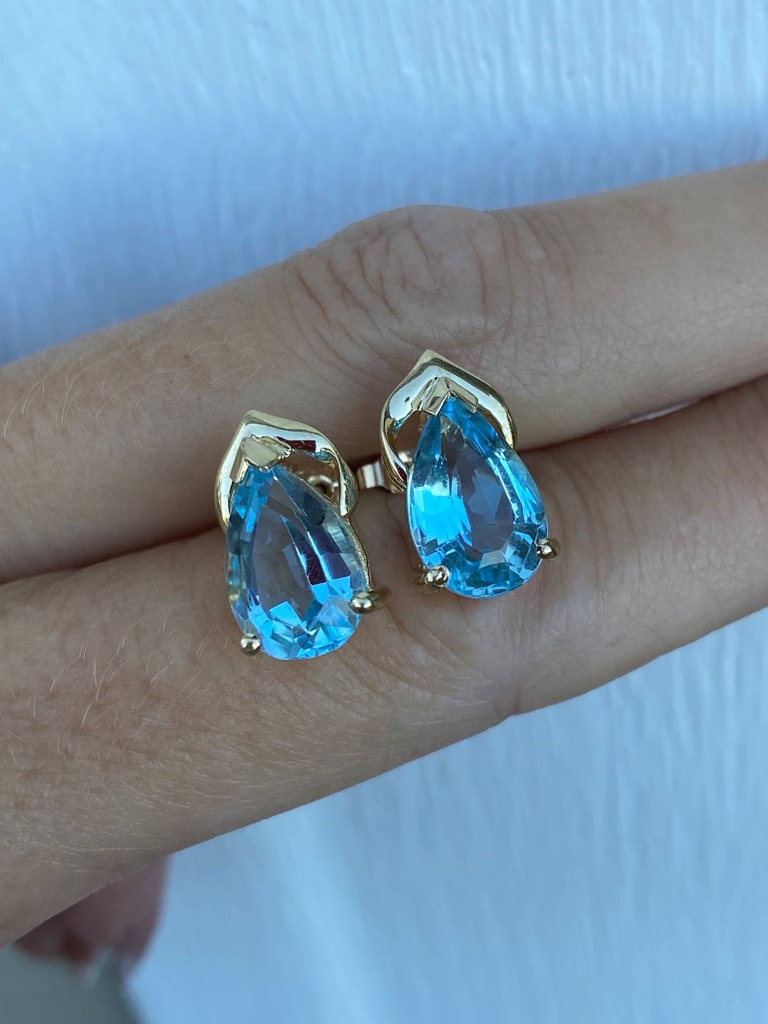 9ct Yellow Gold 1.54ct Pear Cut Blue Topaz Stud Earrings
