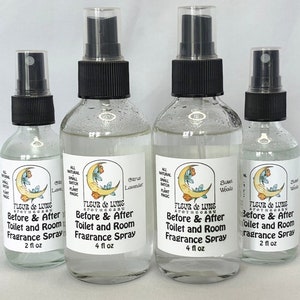 May include: Four glass spray bottles with black tops and labels. The labels are white with a crescent moon design and the text "FLEUR de LUNE APOTHECARY Before & After Toilet and Room Fragrance Spray" with the size of the bottle in ounces. The scents are Citrus Lavender, Sweet Woods, and Sweet Woods.