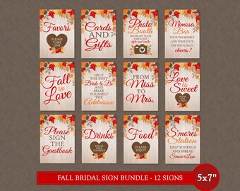 May include: Twelve printable signs for a fall wedding or bridal shower. The signs are 5x7 inches and feature a rustic wood background with fall leaves and text. The signs include "Favors", "Cards and Gifts", "Photo Booth", "Mimosa Bar", "Fall in Love", "Help the Busy Bride to Be", "From Miss to Mrs.", "Love is Sweet", "Please Sign the Guestbook", "Drinks", "Food", and "S'mores Station".