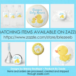 May include: A set of baby shower party favors featuring a yellow rubber ducky with blue bubbles. The favors include water bottle labels, a round cookie, a lollipop, a chocolate kiss, and a favor bag. The text on the favors reads "Briana's Baby Shower".