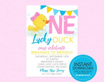 May include: A printable invitation for a first birthday party with a yellow rubber ducky in a bubble bath. The invitation says "One Lucky Duck" and includes the party details: date, time, location, and RSVP information.