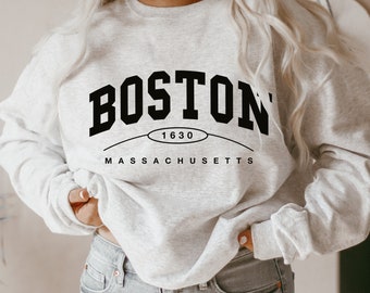 May include: A gray sweatshirt with black text that reads "BOSTON 1630 MASSACHUSETTS".