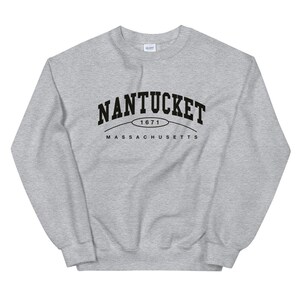 May include: Gray sweatshirt with black text that reads "NANTUCKET 1671 MASSACHUSETTS"