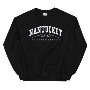 May include: Black sweatshirt with white text that reads "NANTUCKET 1671 MASSACHUSETTS".