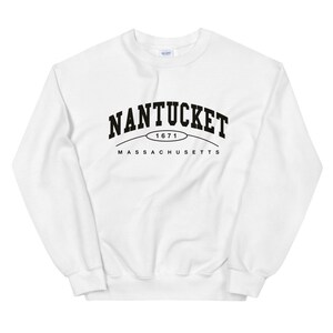 May include: White sweatshirt with black text that reads "NANTUCKET 1671 MASSACHUSETTS".