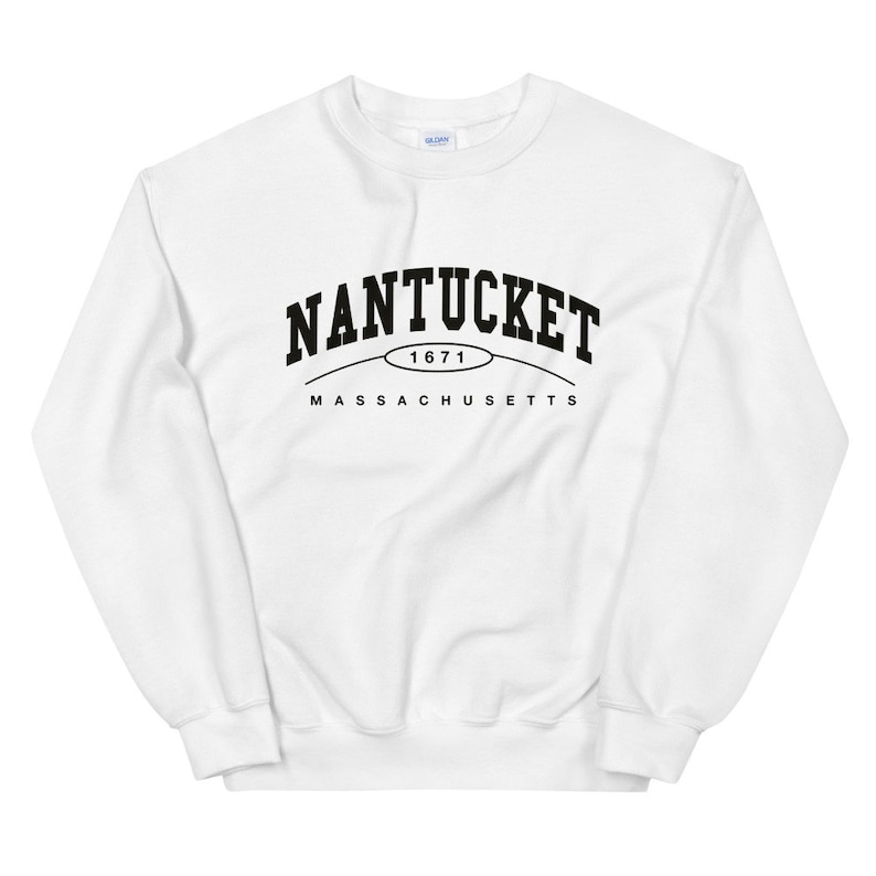 May include: White sweatshirt with black text that reads "NANTUCKET 1671 MASSACHUSETTS".