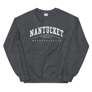 May include: A dark gray sweatshirt with white text that reads "NANTUCKET 1671 MASSACHUSETTS".