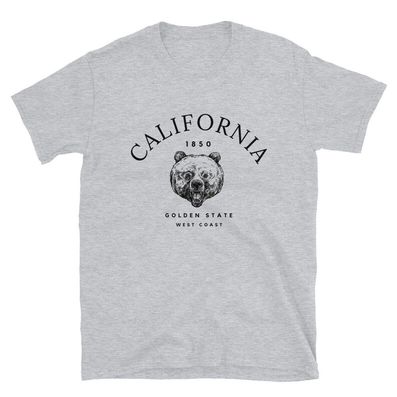 May include: Gray t-shirt with a black graphic of a bear's head and the text "CALIFORNIA 1850 GOLDEN STATE WEST COAST"