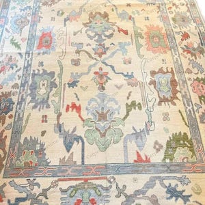 Vintage Oushak Hand Knotted Wool Rug in Soft Pastel Multi-Color for Living room.