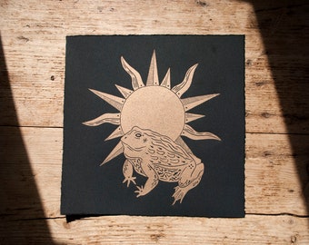 Golden toad linocut print on black velvet somerset paper