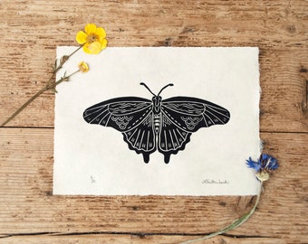 Singular butterfly linocut print on Awagami kitakata paper.