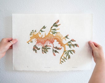 Limited edition of lino print rainbow leafy sea dragon. Home decor, wall art.