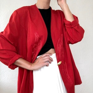 Very nice vintage blazer in red with wide cut long sleeves 70s 80s