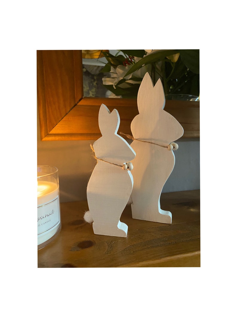 Two Bunnies Handcrafted From Hardwood Available In Several Colours.