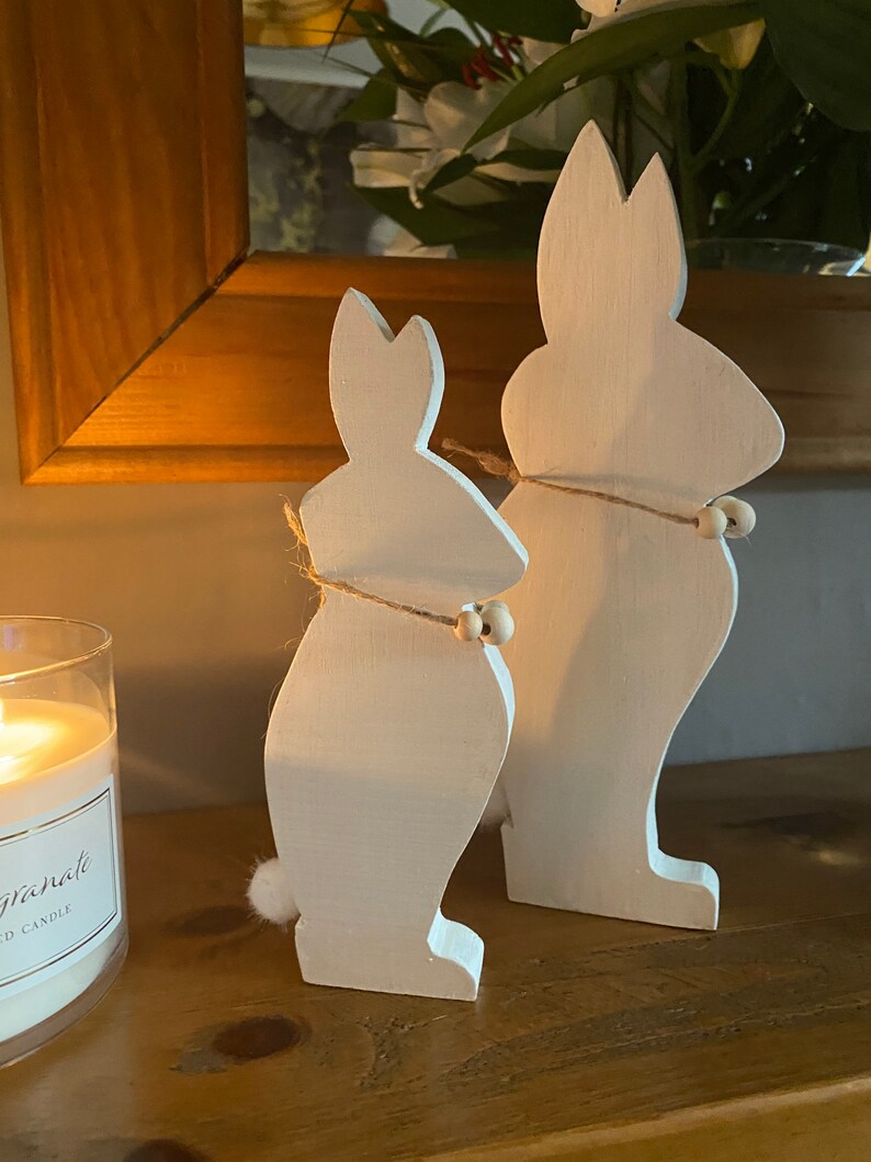Two Bunnies Handcrafted From Hardwood Available In Several Colours.
