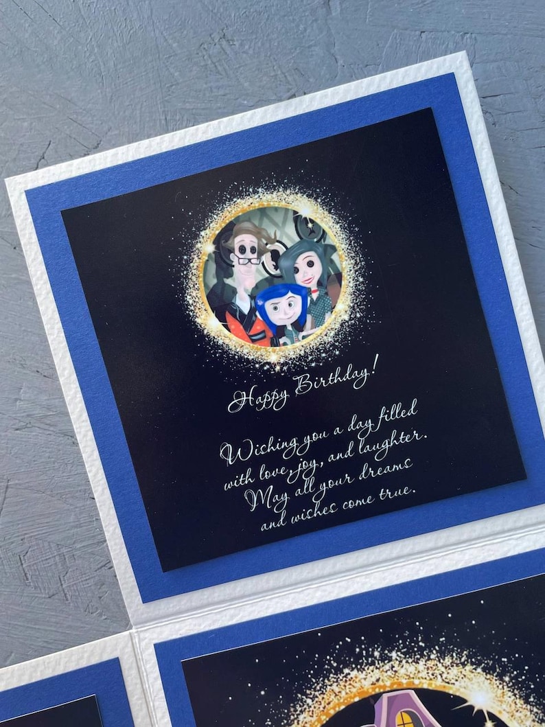 May include: A birthday card with a black background and a gold circle with a family of three characters from the movie "The Addams Family". The text on the card reads "Happy Birthday! Wishing you a day filled with love, joy, and laughter. May all your dreams and wishes come true."