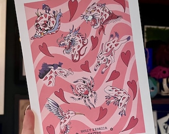 May include: A pink and white print with a variety of images including a skull, a snail, a dragon, a leopard, a rabbit, a horse, a spider, a frog, and a hummingbird. The print has a pink background with white wavy lines and hearts. The text "HOLLY REBECCA TATTOO" is at the bottom of the print.