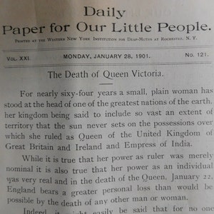May include: A black and white newspaper article from January 28, 1901, titled "Daily Paper for Our Little People." The article discusses the death of Queen Victoria and her reign over the United Kingdom of Great Britain and Ireland.