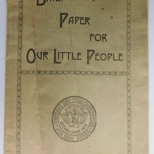 May include: A vintage newspaper headline reads "Daily Paper for Our Little People". The newspaper is printed by students at the Western New York Institution for Deaf Mutes, established in 1876.