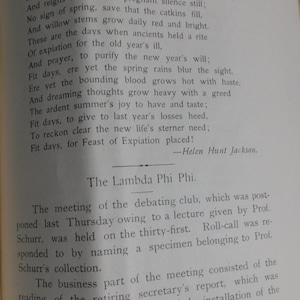 May include: A black and white newspaper clipping from the Daily Paper for Our Little People, dated February 1, 1901. The article discusses the meeting of the Lambda Phi Phi debating club, which was postponed due to a lecture by Professor Schurr. The meeting included the reading of the retiring secretary's report, the installation of new officers, and a literary program featuring a paper on monkeys by James Meagher and a story by Miss Pugh, followed by a paper on snakes by Olga Crane.