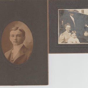 May include: Two vintage black and white photographs in frames. The left photo shows a young man in a suit and tie. The right photo shows a group of three people, including a woman in a dress, a young child, and a man in a suit.