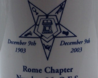 May include: White ceramic mug with blue text and a blue star design. The text reads "100th Anniversary", "December 9th 1903", "December 9th 2003", "Rome Chapter Number 26, O.E.S."