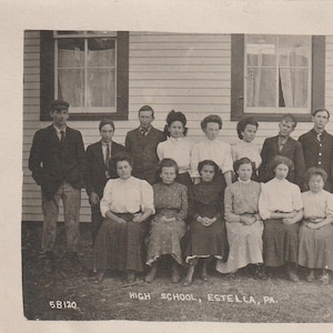 May include: A monochrome photograph of a group of people, possibly a high school class, posing in front of a building. The text "HIGH SCHOOL, ESTELLA, PA." is visible. The photograph is dated.