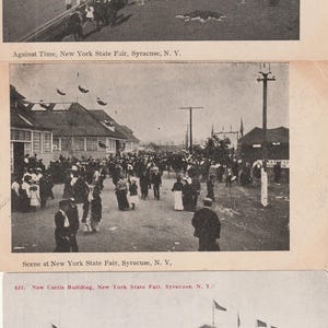 May include: Vintage black and white postcards showing scenes from the New York State Fair in Syracuse. The images depict a racetrack with spectators, a crowded street scene, and a building with flags.