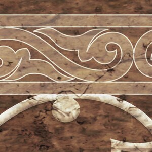 May include: A brown and white decorative tile with a white ornate design. The design features a series of swirls and curves.