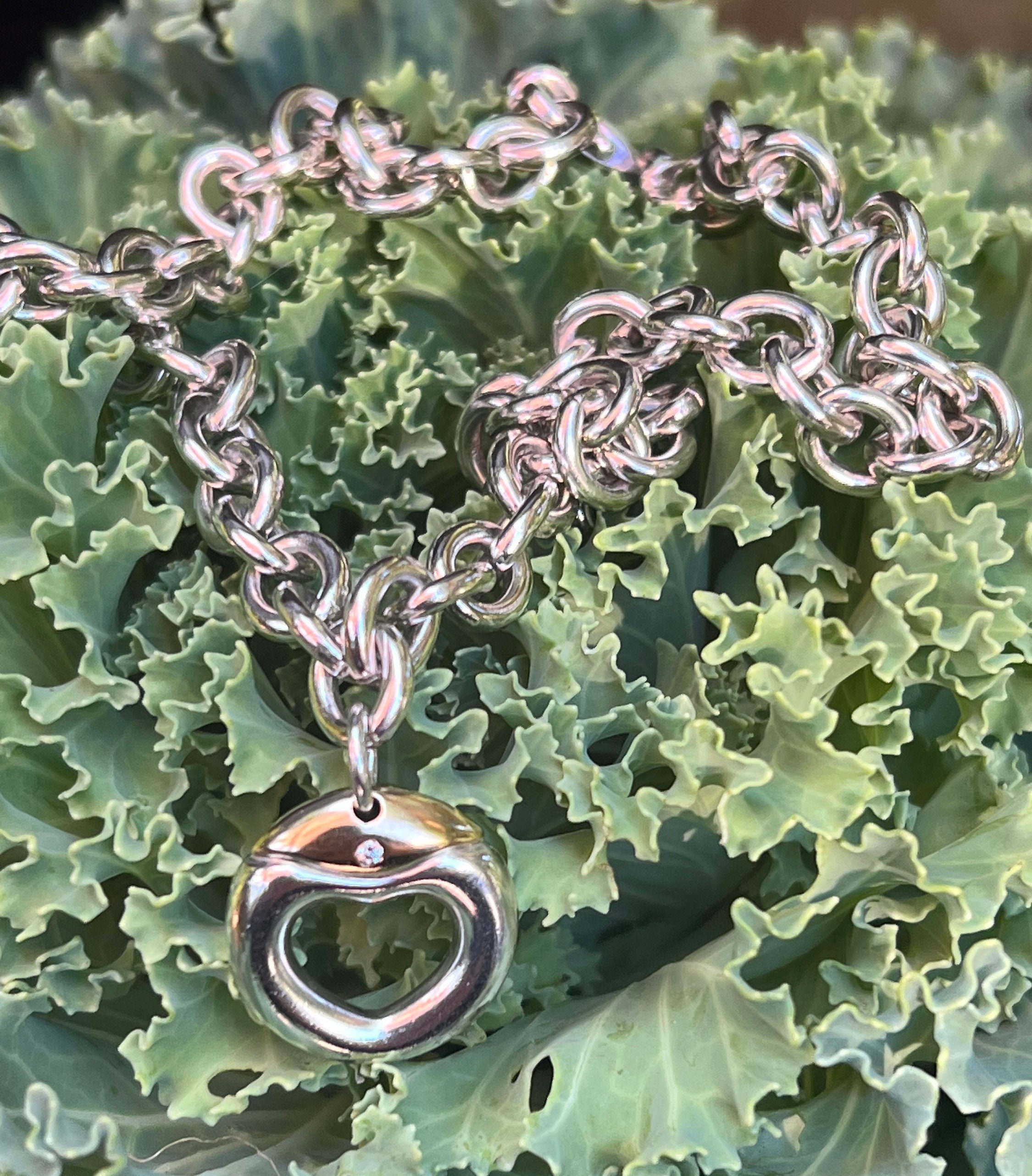 Movado  Sphere Lock Collection sterling silver necklace with a twisting lock  pendant