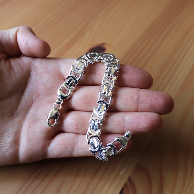 A stunning extra chunky Byzantine bracelet in a flat design. Stylish, bold and contemporary.
modelled on a mans hand

Handmade Sterling Silver 925

10.5mm wide.