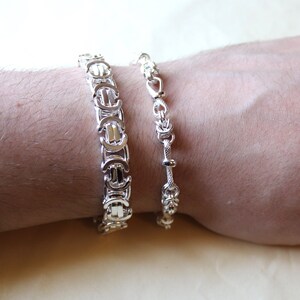 A stunning extra chunky Byzantine bracelet in a flat design. Stylish, bold and contemporary.
modelled on a mans hand

Handmade Sterling Silver 925

10.5mm wide.