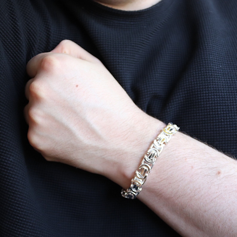 A stunning extra chunky Byzantine bracelet in a flat design. Stylish, bold and contemporary.
modelled on a mans wrist

Handmade Sterling Silver 925

10.5mm wide.