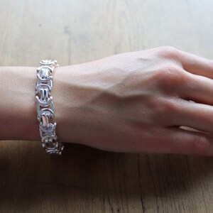 A stunning extra chunky Byzantine bracelet in a flat design. Stylish, bold and contemporary.
modelled on a womans hand

Handmade Sterling Silver 925

10.5mm wide.