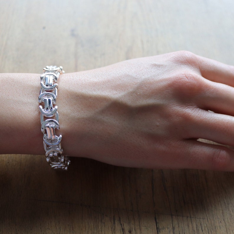 A stunning extra chunky Byzantine bracelet in a flat design. Stylish, bold and contemporary.
modelled on a womans hand

Handmade Sterling Silver 925

10.5mm wide.